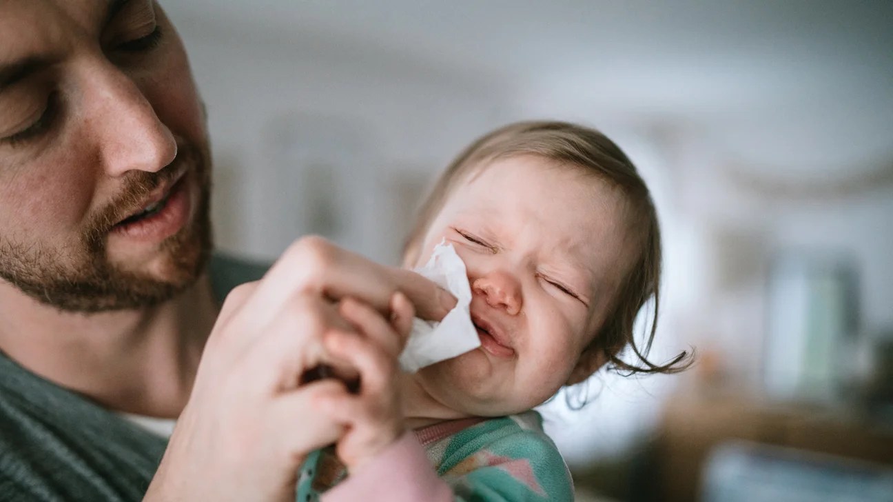 Toddler receiving soothing treatment for cough